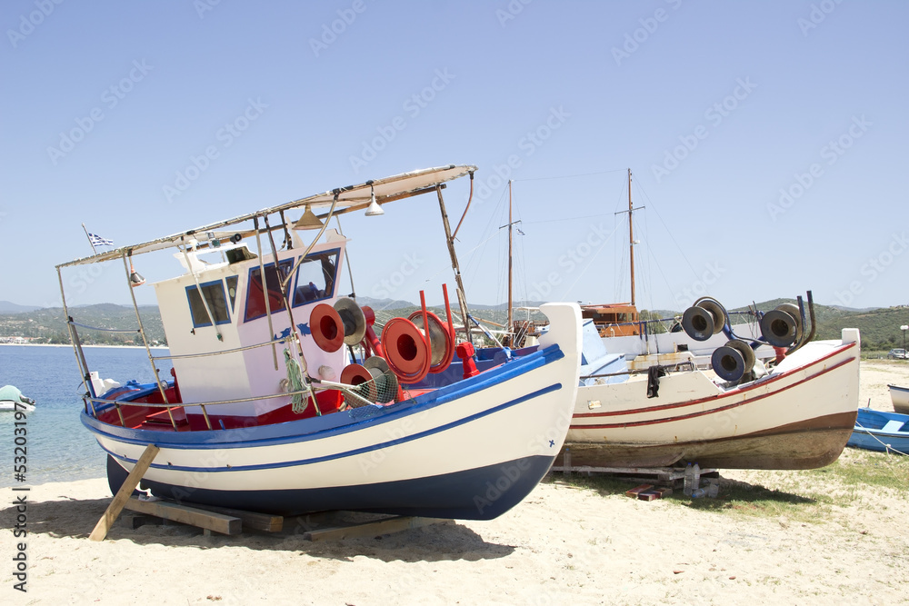Two fishing boats at the sand beach