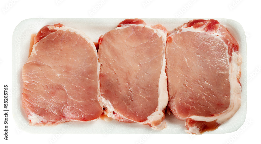 Pack of raw pork meat in a plate on white Pack of raw pork meat in a plate on white