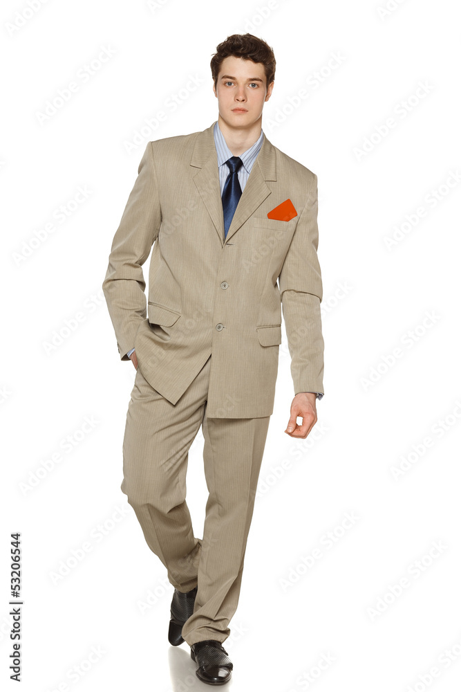Business man walking with blank credit card in his breast pocket Business man walking with blank credit card in his breast pocket
