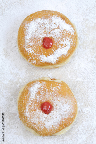 Hanukkah sufganiya, doughnut with jam and caster suga