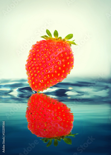 Strawberry in water photo