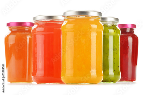 Jars of fruity jams isolated on white background