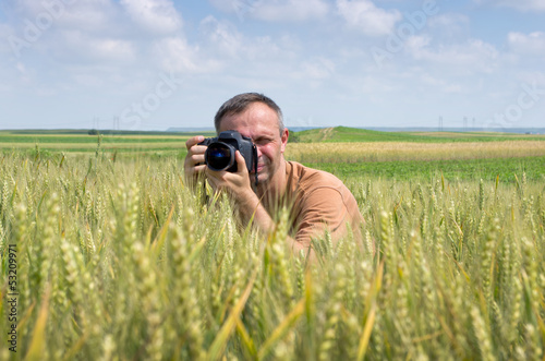 photographer in wheat field
