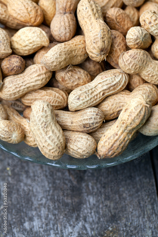 peanuts on wooden table peanuts on wooden table