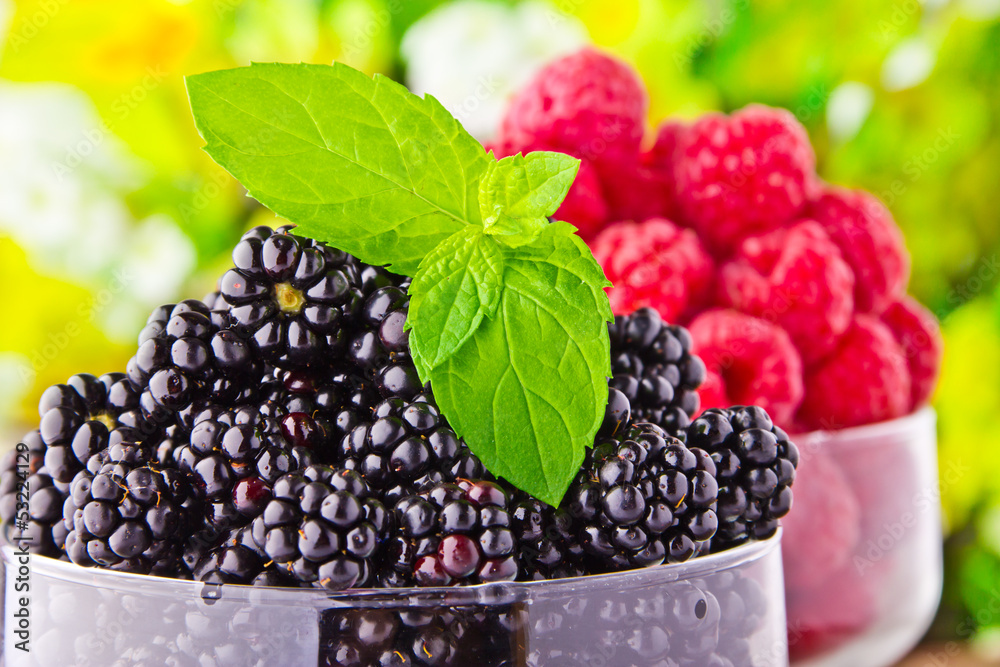 Sweet fresh fruits in glass goblet with mint leaf Sweet fresh fruits in glass goblet with mint leaf