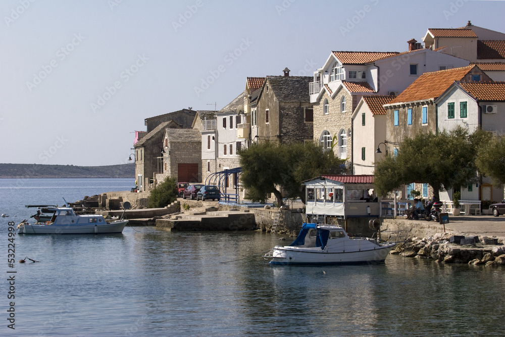 Old Dalmatian stone houses on the coast in Primosten in croatia