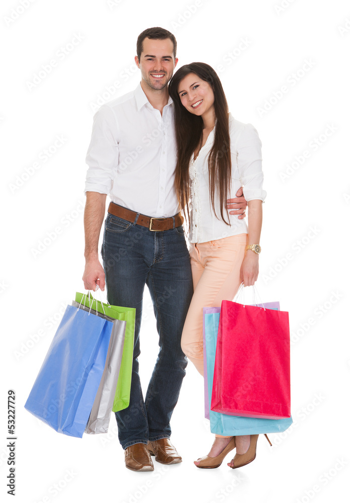Portrait Of Young Couple Holding Shopping Bag Portrait Of Young Couple Holding Shopping Bag