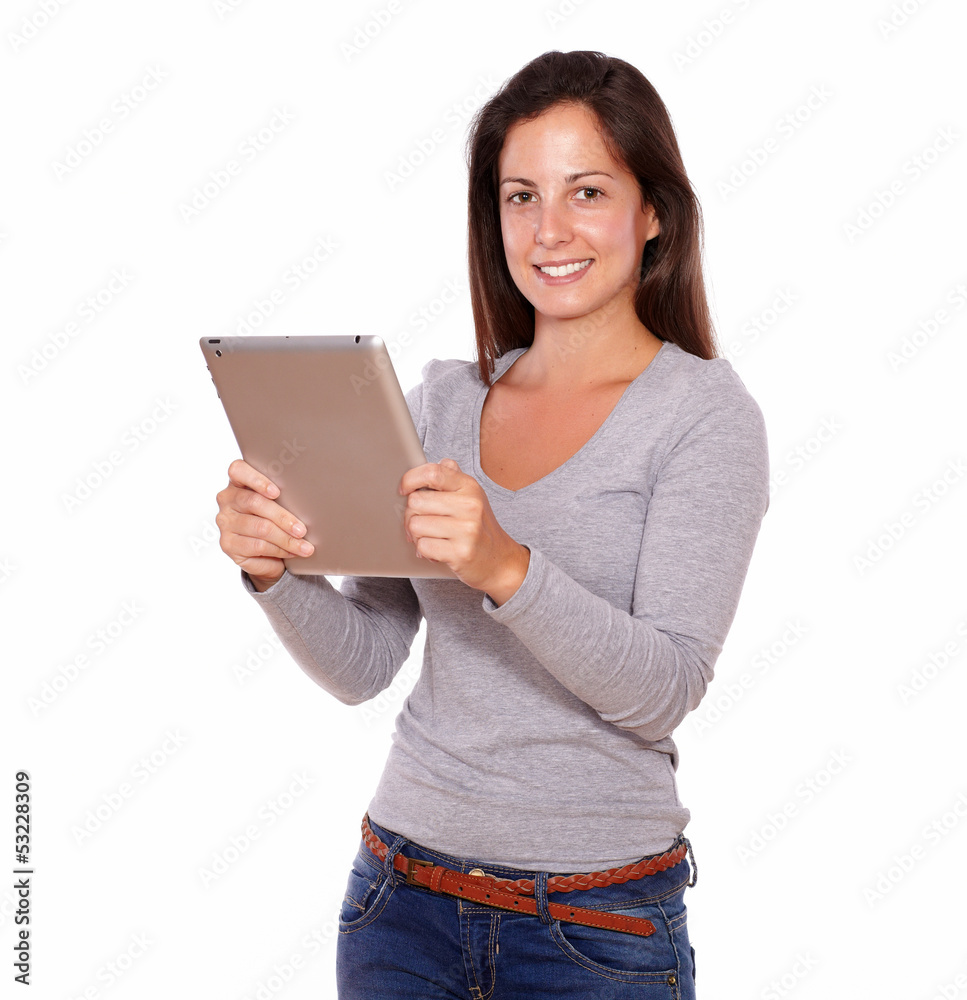 Charming lady working on tablet pc while standing Charming lady working on tablet pc while standing