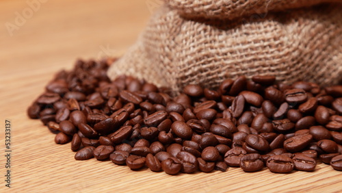 coffee beans in a burlap bag © charnsitr