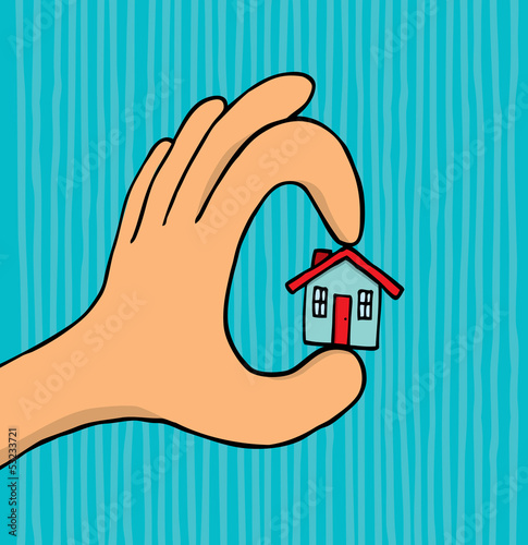Hand holding tiny house