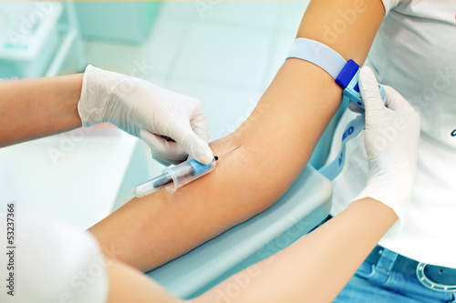 the nurse is going to loosening a tourniquet during the injectio
