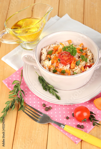 Delicious rice with vegetables and herbs in pot