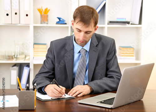 Young businessman in office...