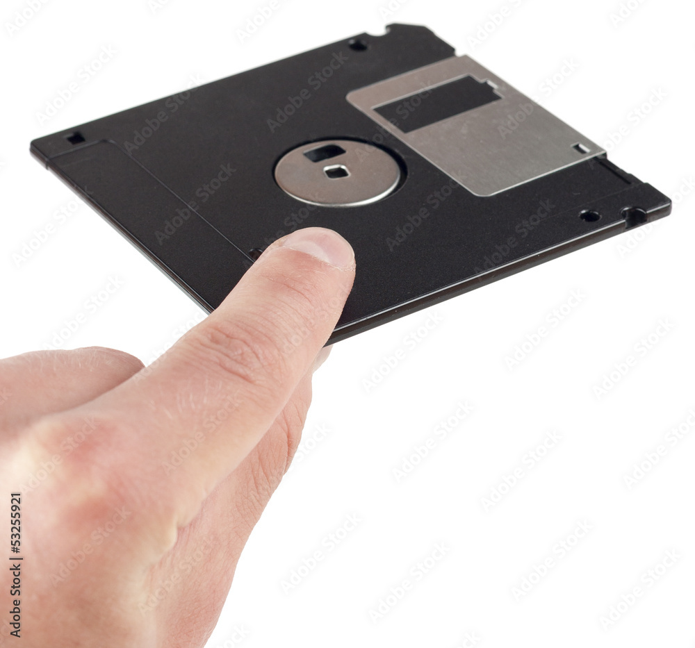 Floppy disk between fingers Floppy disk between fingers