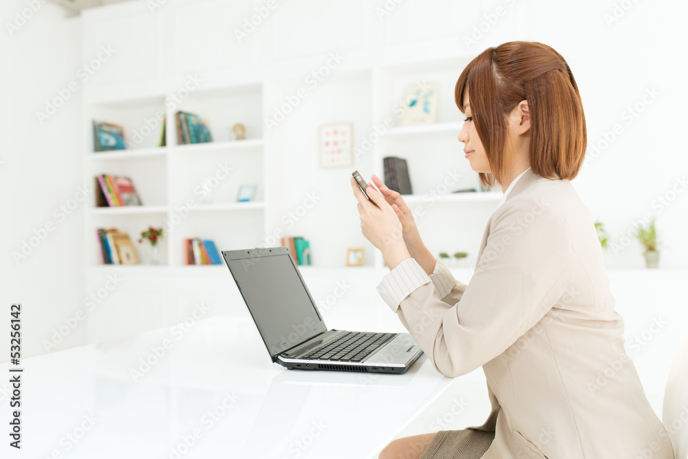 Beautiful young businesswoman working in office Beautiful young businesswoman working in office