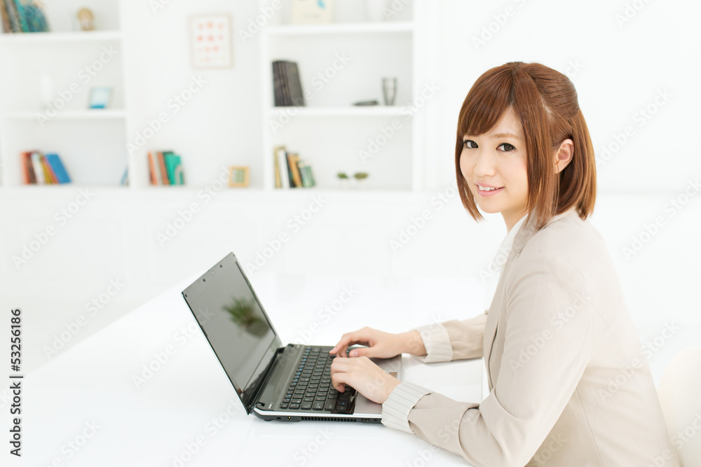 Beautiful young businesswoman working in office Beautiful young businesswoman working in office