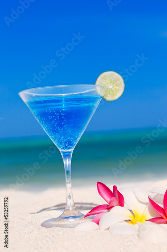 blue cocktail at tropical beach