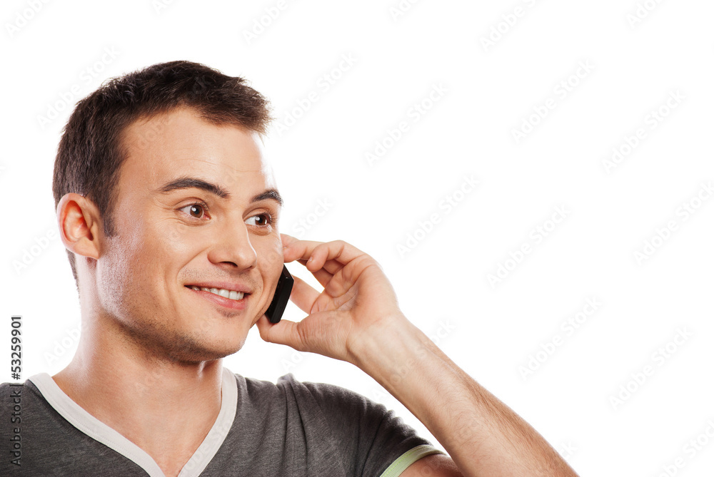 Happy man answering the phone isolated Happy man answering the phone isolated