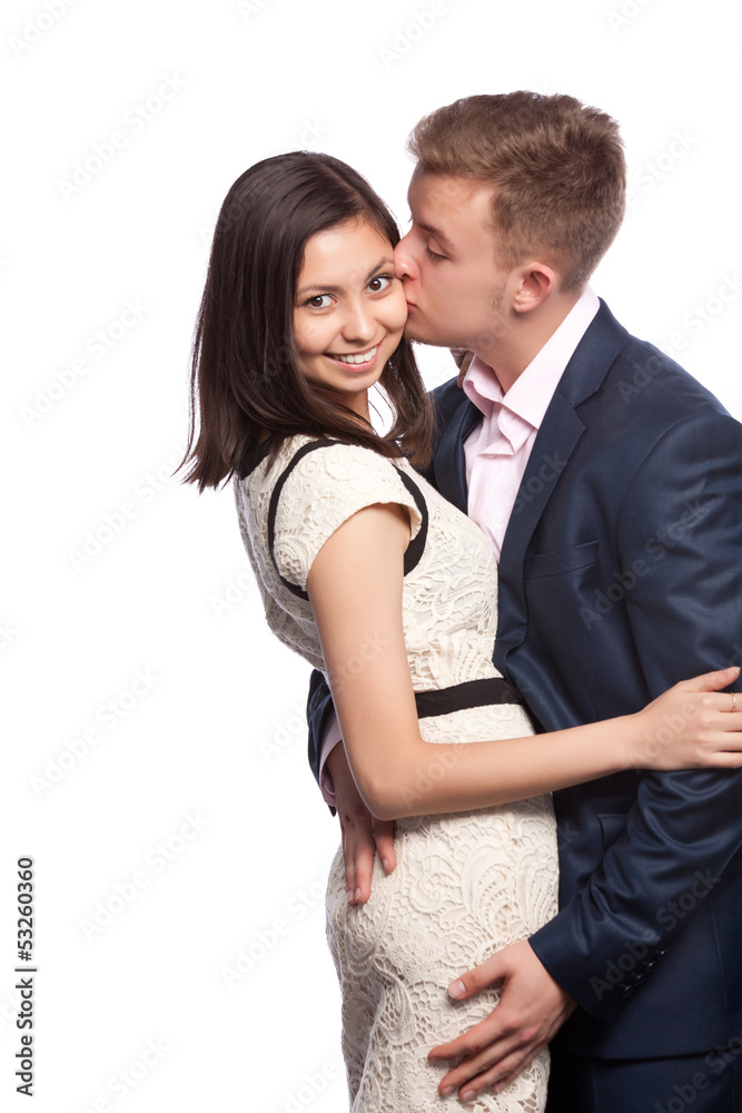 Man kissing his girlfriend on the cheek