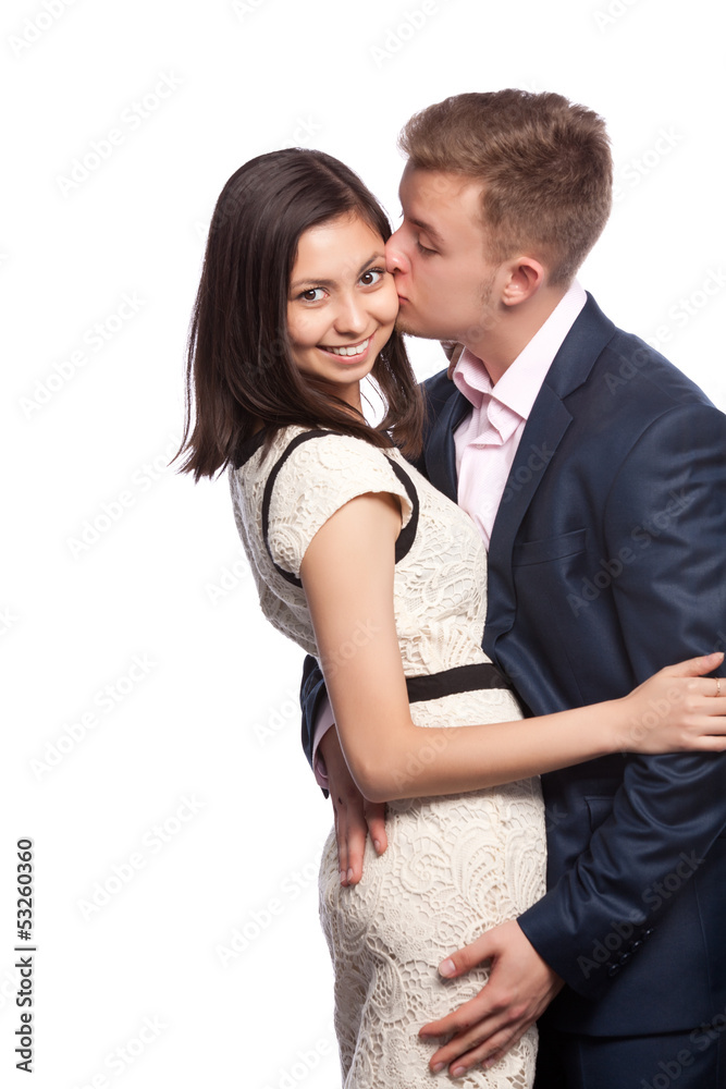Man kissing his girlfriend on the cheek Man kissing his girlfriend on the cheek