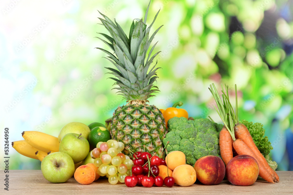 Assortment of fresh fruits and vegetables on natural background Assortment of fresh fruits and vegetables on natural background