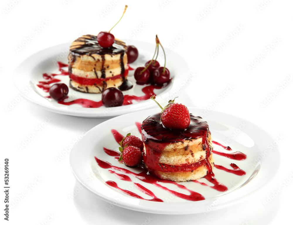 Tasty biscuit cakes with jam and berries