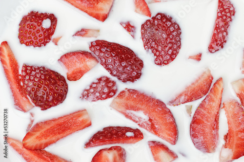 slices of strawberry in milk
