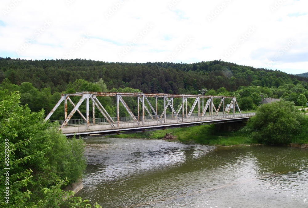 old metallic bridge across Wisloka river in Krempna
