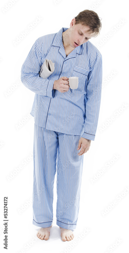 Sleeping man standing in pajamas with newspaper Stock Photo | Adobe Stock