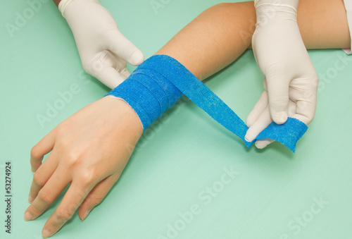 Wound dressing appy medicine bandage on wrist injury