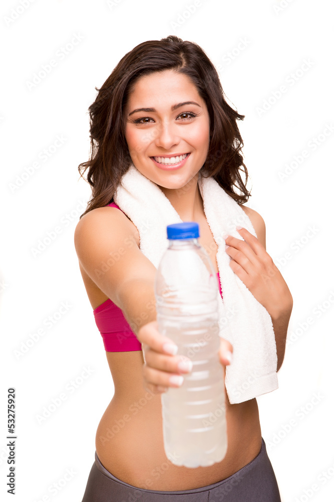 Attractive fitness woman posing with gym towel holding a bottle Attractive fitness woman posing with gym towel holding a bottle