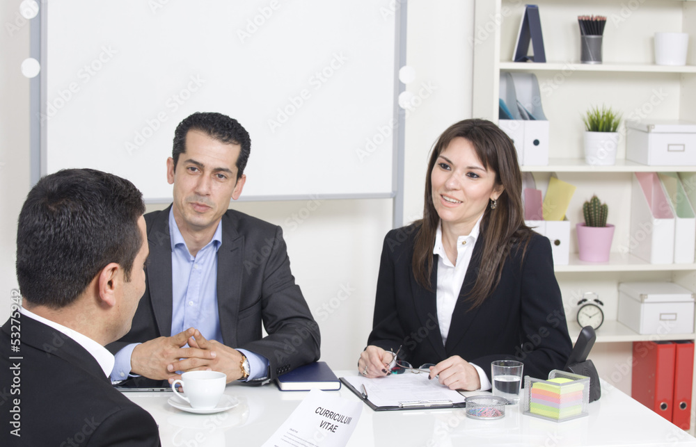 man explaining about her profile to business managers at a job i man explaining about her profile to business managers at a job i