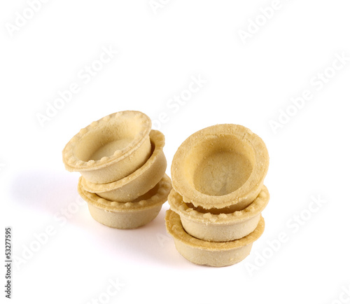 Pile of empty tartlets isolated