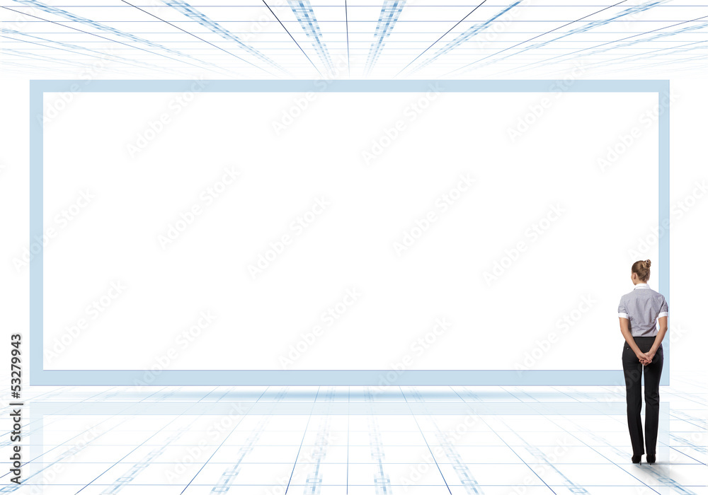 Business person standing near a blank billboard Business person standing near a blank billboard