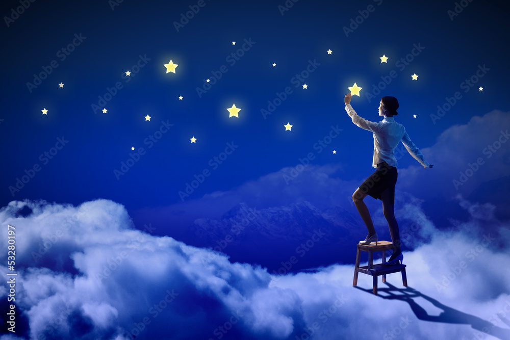 Naklejka premium Woman lighting stars