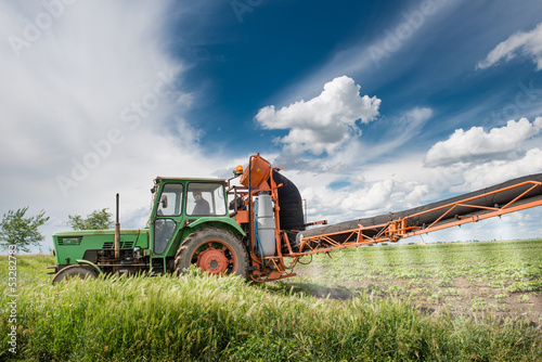 tractor spraying pesticides