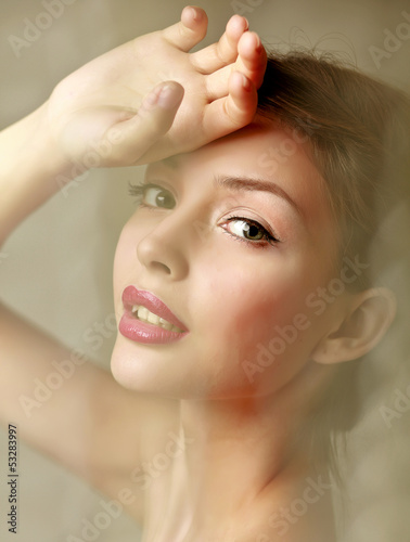 A beautiful woman, portrait isolated on grey background