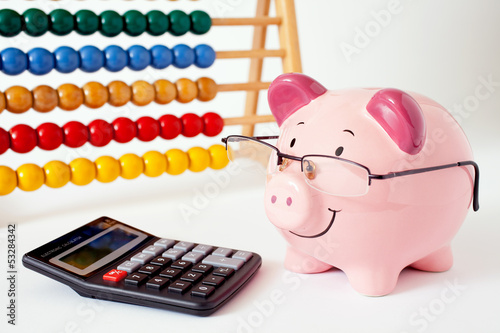 Piggy Bank With Abacus And Calculator photo