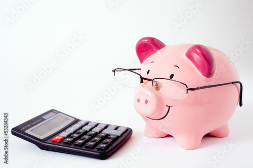 Pink Piggy Bank With Calculator. photo