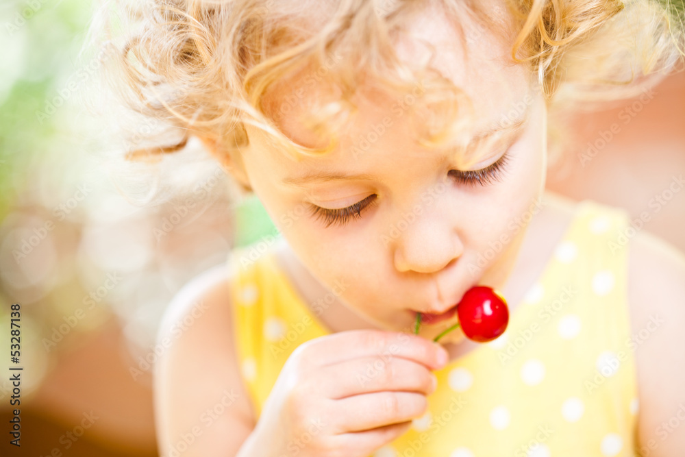 Little Girl eats sweet cherries outdoor Little Girl eats sweet cherries outdoor