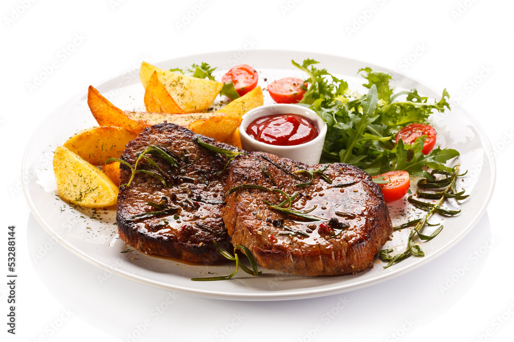 Grilled steaks, baked potatoes and vegetables Grilled steaks, baked potatoes and vegetables