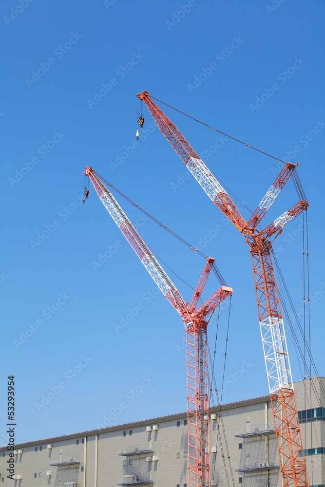 Construction site with crane over a building