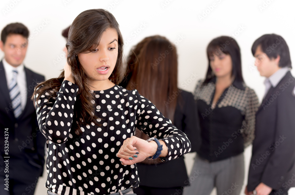 businesswoman checking the time, group shot businesswoman checking the time, group shot
