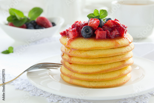 Pancakes with summer berries: strawberries, blueberries.