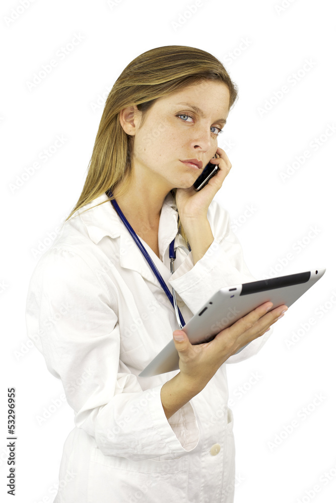Serious female doctor talking on the phone Serious female doctor talking on the phone