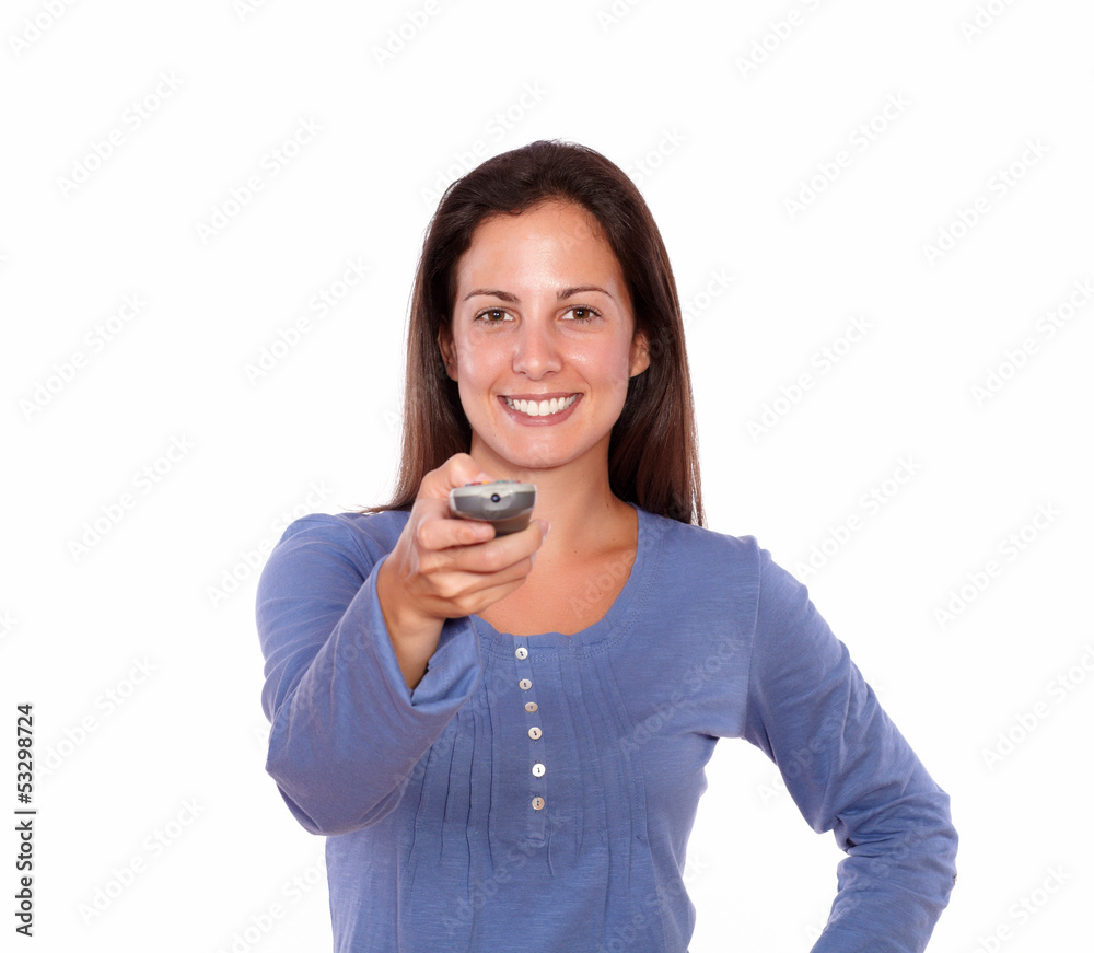 Pretty young woman pointing remote control Pretty young woman pointing remote control