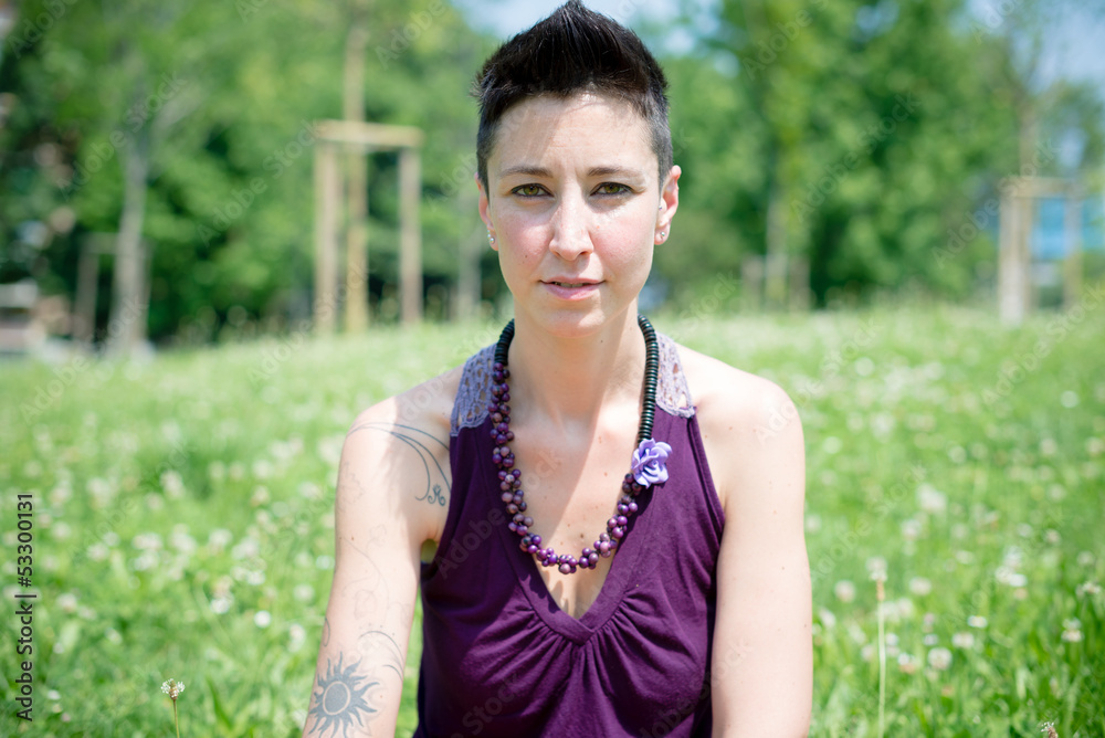 beautiful hipster short hair woman in the park beautiful hipster short hair woman in the park