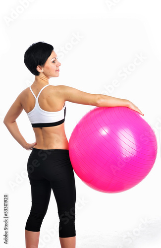 Young woman with a fitness ball