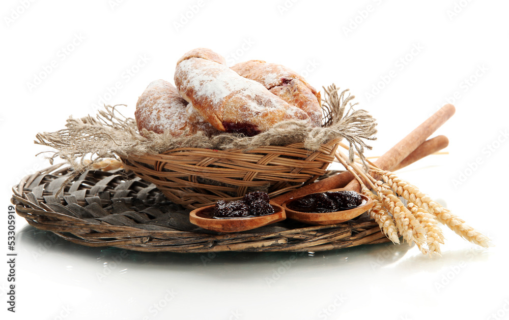 Taste croissants in basket and jam isolated on white.