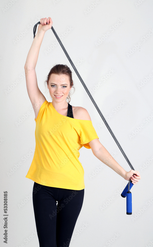Beautiful young woman with skipping rope Beautiful young woman with skipping rope